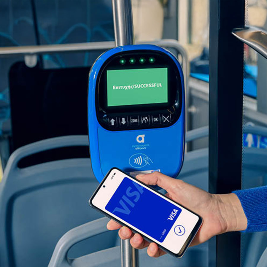 Someone scanning digital visa card via phone on the bus