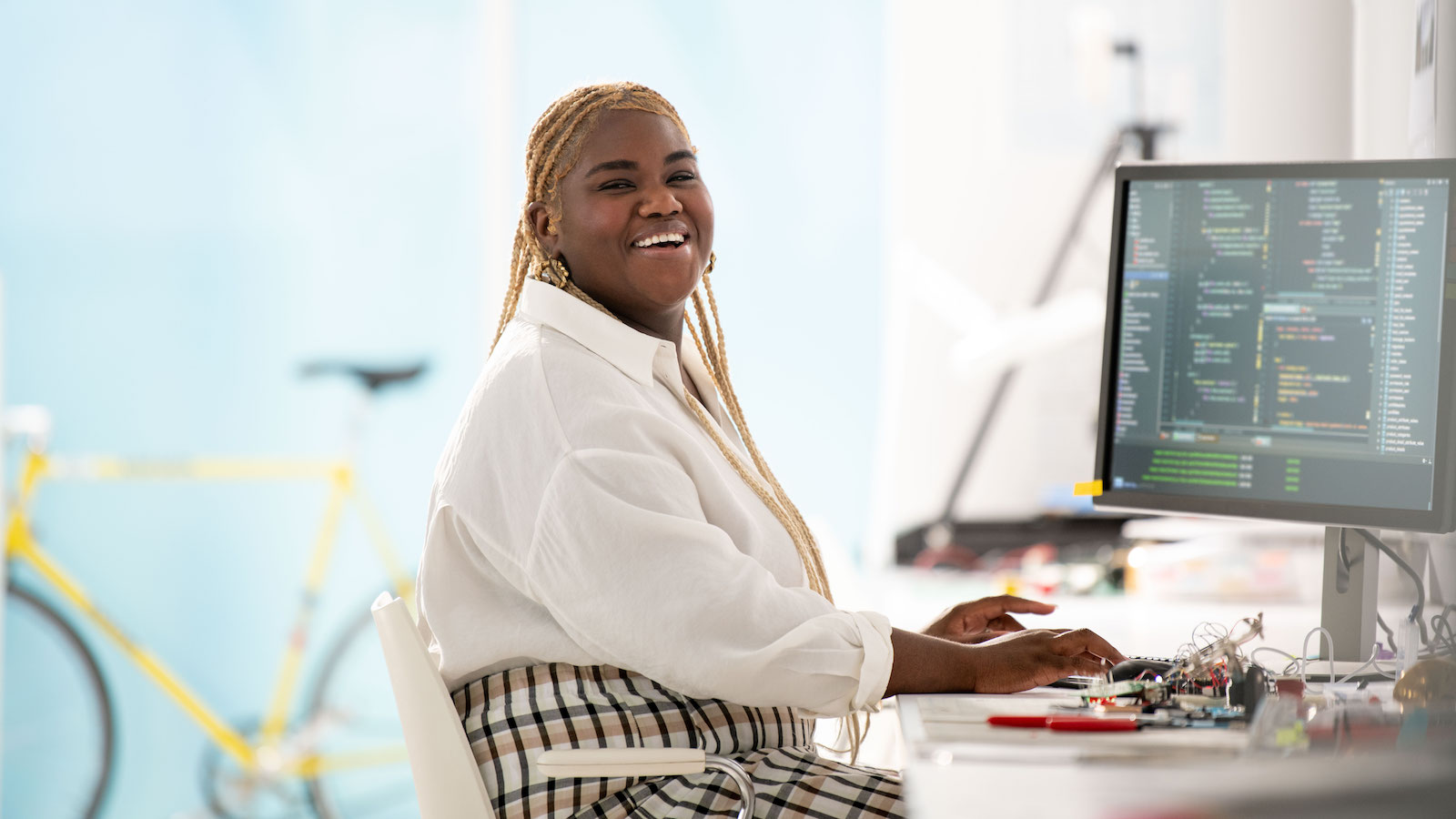 Girl smiling at computer