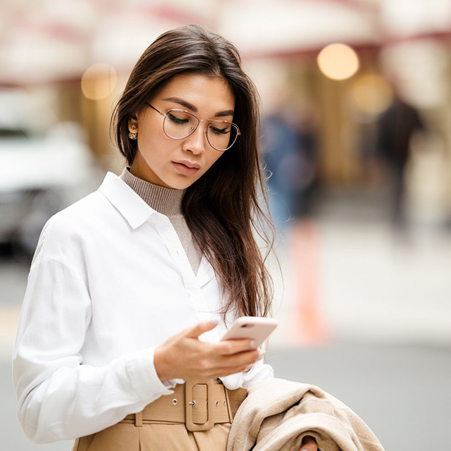 woman looking at mobile